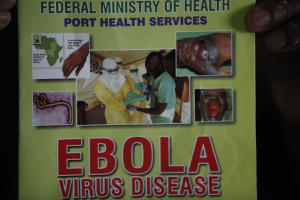 Nigeria health official display a leaflet explaining&nbsp;&hellip;