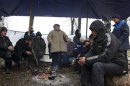 Workers spend time under a tent during their hunger strike near a steel mill in Verkhnyaya Sinyachikha