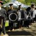 Students hold letters spelling out "No layoffs" at Harvard University in Cambridge