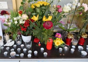 Flowers and candles have been left to commemorate a &hellip;