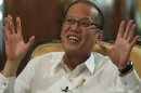 File photo of Philippine President Aquino gesturing during an interview with Reuters at the Malacanang presidential palace in Manila