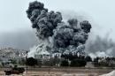 Smoke rises after a strike on the Syrian town of Ain al-Arab, known as Kobane by the Kurds, on October 12, 2014