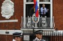Wikileaks founder Julian Assange gestures as he speaks from the balcony of Ecuador's embassy, where he is taking refuge in London