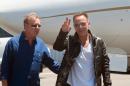 US musician Bruce Springsteen (R) and South African promoter Attie van Wyk at Cape Town Airport on January 24, 2014