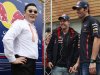 South Korean singer Psy, Vettel of Germany and teammate Webber of Australia talk after performing Psy's "Gangnam style" dance prior to the South Korean F1 Grand Prix at the Korea International Circuit in Yeongam