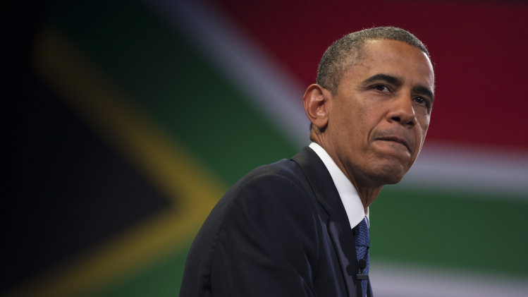U.S. President Barack Obama pauses during a town hall meeting with young African leaders at the University of Johannesburg Soweto on Saturday, June 29, 2013, in Johannesburg, South Africa. The president is in South Africa, embarking on the second leg of his three-country African journey. The visit comes at a poignant time, with former South African president and anti-apartheid hero Nelson Mandela ailing in a Johannesburg hospital. (AP Photo/Evan Vucci)