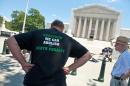 A man wears an anti-death penalty tee-shirt during the 20th annual Starvin' for Justice fast and vigil against the death penalty in front of the US Supreme Court in Washington on June 29, 2013