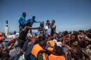 The United Nations says there has been an 83 percent rise in migrants making the perilous journey across the Mediterranean, such as these migrants who were rescued off the coast of Sicily in May 2015