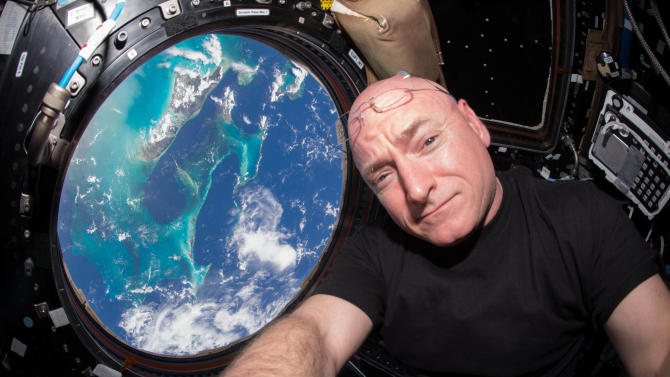 This July 12, 2015 photo made available by NASA, astronaut Scott Kelly poses for a selfie photo in the &quot;Cupola&quot; of the International Space Station. On Friday, Oct. 16, 2015, Kelly broke the U.S. record for the most time spent in space Friday _ 382 days. (Scott Kelly/NASA via AP)