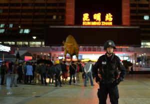A policeman stands guard as Chinese mourners light&nbsp;&hellip;