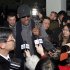 Flamboyant former NBA star Dennis Rodman is surrounded by journalists upon arrival at Pyongyang Airport, North Korea, Tuesday, Feb. 26, 2013. The American known as "The Worm" arrived in Pyongyang, becoming an unlikely ambassador for sports diplomacy at a time of heightened tensions between the U.S. and North Korea. (AP Photo/Kim Kwang Hyon)