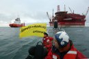Photos: Greenpeace activists storm Russian oil rig
