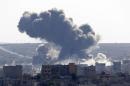 An explosion following an air strike is seen in central Kobani