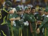 Pakistan's Hasan celebrates with teammates after dismissing Australia's Watson during ICC World Twenty20 Super 8 cricket match in Colombo