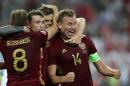 Russia's defender Vasily Berezutskiy (R) is congratulated by teammates after scoring a goal during the Euro 2016 group B football match between England and Russia at the Stade Velodrome in Marseille on June 11, 2016