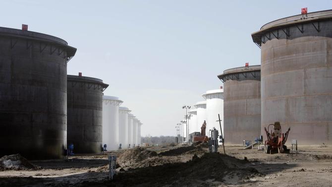 This March 13, 2012 photo shows older and newly constructed 250,000 barrel capacity oil storage tanks at the SemCrude tank farm north of Cushing, Okla. For the past seven weeks, the United States has been producing and importing an average of 1 million more barrels of oil every day than it is consuming. That extra crude is flowing into storage tanks, especially at the country's main trading hub in Cushing, pushing U.S. supplies to their highest point in at least 80 years, the Energy Department reported Wednesday, Feb. 25, 2015. (AP Photo/Tulsa World, Michael Wyke) KOTV OUT; KJRH OUT; KTUL OUT; KOKI OUT; KQCW OUT; KDOR OUT; TULSA OUT; TULSA ONLINE OUT