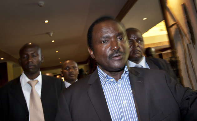 Kalonzo Musyoka, center, Kenya's current Vice President and running mate of presidential candidate Raila Odinga, gestures as he leaves after speaking at a press conference in Nairobi, Kenya Thursday, March 7, 2013. The coalition of Kenya's prime minister Raila Odinga says the vote
   tallying


 process

 now

 under
 way to determine the winner
 of the country's presidential election "lacks integrity", should be stopped, and the counting process should be restarted using primary documents from polling stations. (AP Photo/Ben Curtis)