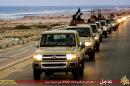An image made available by propaganda Islamist media outlet Welayat Tarablos on February 18, 2015 allegedly shows members of the Islamic State group parading in a street in Libya's coastal city of Sirte