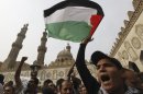 Egyptian protesters shout slogans against Israel's ongoing military operation in Gaza Strip, in old Cairo