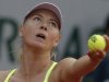 Russia's Maria Sharapova serves against Su-Wei Hsieh of Taipei in their first round match of the French Open tennis tournament, at Roland Garros stadium in Paris, Monday, May 27, 2013. (AP Photo/Michel Spingler)