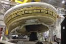 In this undated image provided by NASA a saucer-shaped test vehicle holding equipment for landing large payloads on Mars is shown in the Missile Assembly Building at the US Navy's Pacific Missile Range Facility in Kauai, Hawaii. On Wednesday, June 11, 2014 weather permitting, a balloon carrying the saucer-shaped vehicle is set to launch from Hawaii. (AP Photo/NASA)