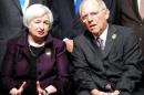 US Federal Reserve Chair Janet Yellen and German Finance Minister Wolfgang Schauble talk as they pose for a group photo during the G20 finance ministers and central bank chiefs meeting in Istanbul, on February 10, 2015