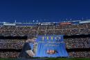 A banner is displayed reading in Catalan: "Tito forever eternal" in honor for late former FC Barcelona's coach Tito Vilanova prior to the Spanish La Liga soccer match between FC Barcelona and Getafe at the Camp Nou stadium in Barcelona, Spain, Saturday, May 3, 2014. FC Barcelona announced on their web page Friday April 25, 2014, that Vilanova had died following a long battle with throat cancer. He was 45. (AP Photo/Manu Fernandez)