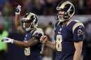 St. Louis Rams quarterback Sam Bradford, right, and Chris Givens celebrate their 31-28 victory over the Washington Redskins in an NFL football game, Sunday, Sept. 16, 2012, in St. Louis. (AP Photo/Seth Perlman)