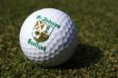 A St. Andrews souvenir golf ball is seen on a golf course in London