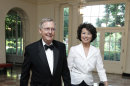 Senate Republican Leader Sen. Mitch McConnell, R-Ky., and his wife former Labor Secretary Elaine Chao, arrive for a State Dinner hosted by President Barack Obama and first lady Michelle Obama in honor of German Chancellor Angela Merkel at the White House in Washington, Tuesday, June 7, 2011. (AP Photo/Manuel Balce Ceneta)