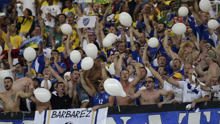 Bosnian fans cheer their team before the group F World Cup soccer match between Nigeria and Bosnia at the Arena Pantanal in Cuiaba, Brazil, Saturday, June 21, 2014. (AP Photo/Dolores Ochoa)