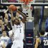 Connecticut's DeAndre Daniels lines up a dunk as Georgetown's Otto Porter Jr. (22) watches during the first half of an NCAA college basketball game in Storrs, Conn., Wednesday, Feb. 27, 2013. (AP Photo/Jessica Hill)