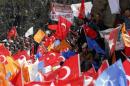 Supporters of the ruling AK Party wave Turkish and party flags during an election rally in Konya