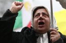 A supporter of the People's Mojahedin Organization Of Iran cries as she demonstrates outside the U.S. Embassy in London