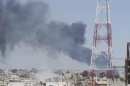 Smoke rises after what activists said was a missile fired by a Syrian Air Force fighter jet loyal to President Bashar al-Assad in Deraa
