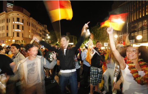 Soccer fans celebrate after the Euro 2012 Group B match between Germany and Portugal in Berlin
