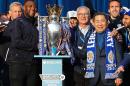 Leicester City's owner and chairman Vichai Srivaddhanaprabha (3rdR), manager Claudio Ranieri (C) and defender Wes Morgan (2ndL) stand with the Premier League trophy on May 16, 2016