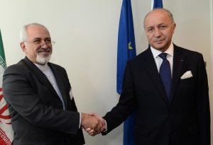 French Foreign Minister Laurent Fabius (R) meets with …