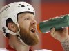Washington Capitals defenseman Erskine has a drink as he works out at the team's facility in Arlington
