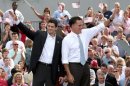 Republican presidential candidate Mitt Romney (right) and his running mate Paul Ryan wave to supporters