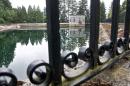 The Mount Tabor number 1 reservoir in Portland, Ore., is seen in a June 20, 2011 photo. Portland officials said Wednesday, April 16, 2014 that they are flushing away millions of gallons of treated water for the second time in less than three years because someone urinated into a city reservoir. In June 2011, the city drained a 7.5 million-gallon reservoir at Mount Tabor in southeast Portland. This time, 38 million gallons from a different reservoir at the same location will be discarded after a 19-year-old was videotaped in the act (AP Photo/The Oregonian, Benjamin Brink)
