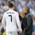 Real Madrid's coach Mourinho talks to Cristiano Ronaldo during their Champions League semi-final first leg soccer match against Barcelona in Madrid