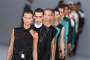Models present creations during the HUGO Fashion Show by Hugo Boss at Berlin Fashion Week in Berlin