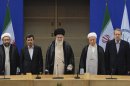 In this photo taken on Thursday, Aug. 30, 2012, and released by the official website of the Iranian supreme leader's office, supreme leader Ayatollah Ali Khamenei, center, parliament speaker Ali Larijani, right, chief of Expediency Council, Akbar Hashemi Rafsanjani, second right, President Mahmoud Ahmadinejad, second left, and judiciary chief Sadeq Larijani, left, listen to Iran's national anthem, at the opening session of the Nonaligned Movement, NAM, summit, in Tehran, Iran. (AP Photo/Office of the Supreme Leader)