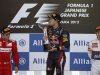 Red Bull Formula One driver Vettel kisses his trophy on podium next to second placed Ferrari Formula One driver Massa and thrid placed Sauber Formula One driver Kobayashi after Japanese F1 Grand Prix at Suzuka circuit