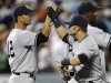 New York Yankees' Chavez and Swisher celebrate their win against the New York Mets in their MLB Interleague baseball game in New York