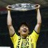 Borussia Dortmund Kagawa celebrates with the German championship trophy after defeating Bayern Munich to win the German DFB Cup (DFB Pokal) final soccer match at the Olympic stadium in Berlin