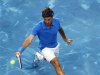 Federer of Switzerland returns ball to Berdych of the Czech Republic during the Madrid Open final tennis match in Madrid