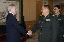 United States Secretary of the Navy Mabus shakes hands with China's Defense Minister Liang during a meeting in Beijing