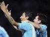 Argentina's Angel Di Maria celebrates near his teammate Lionel Messi after scoring against Paraguay during their World Cup's 2014 qualifying soccer match in Cordoba